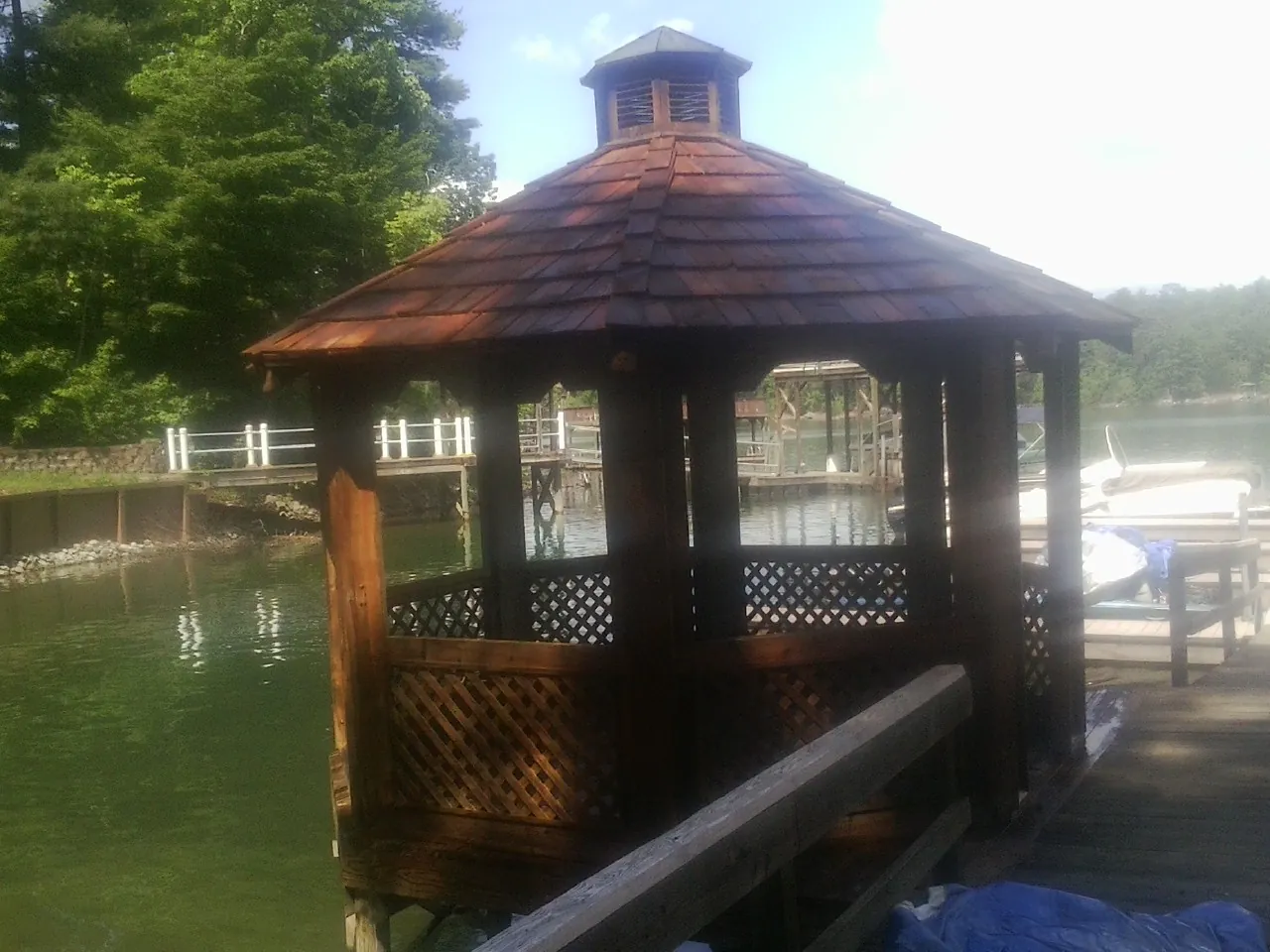 Cedar shake gazebo roof rebuilt on a lake dock in East Carbon